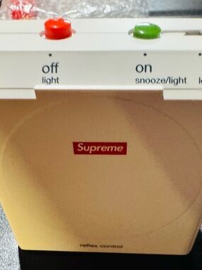 Supreme White Alarm Clock with Red Logo and Red/Green Buttons